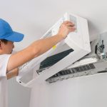 An HVAC expert cleans ducts and air filters to reduce noise in the system.