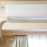 Wall-mounted HVAC unit in a home – understanding HVAC warranty coverage for essential systems.