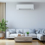 Modern living room featuring a white ductless mini-split HVAC unit, illustrating how long HVAC systems last in Arizona with proper maintenance.